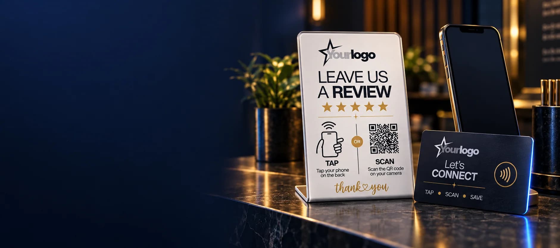 A personalised QRTAP review stand, NFC card and phone on a premium business counter